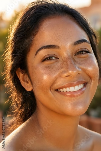 Young Latina Woman With Freckles and Glowing Olive Skin