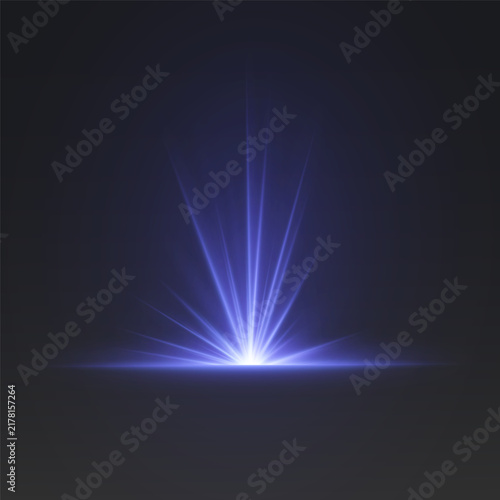 Blue light rays rising from bright glow on dark abstract visual background