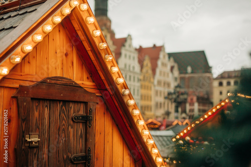 Close-up view of light bulbs on a wooden house at the Christmas market in Wroclaw, Poland.