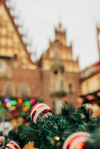 Christmas decorations on houses at the Christmas market in Wroclaw, Poland. View of garlands, ornaments and fir branches