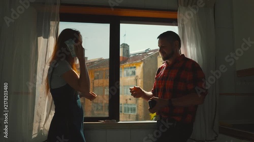 Woman paying a man in cash for his services