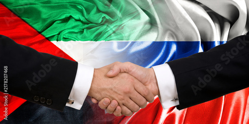 Konstfotografi Handshake between Russia and Sudan, international friendship, background with flags