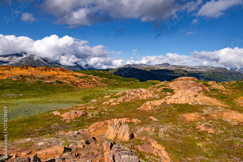 Konstfotografi A beautiful mountain nature reserve landscape with bright orange rock outcrops