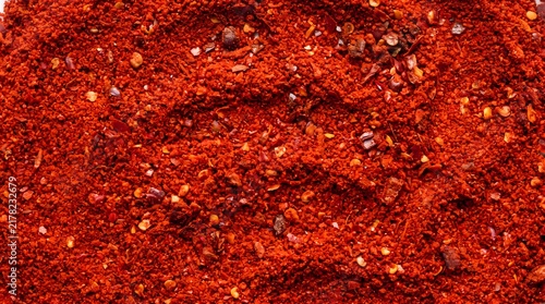 Colorful spice powder spectrum. Turmeric, cumin, paprika, chili and saffron seasoning. Fresh aromatic food ingredients isolated on white background. Culinary cooking ingredients with copy space.