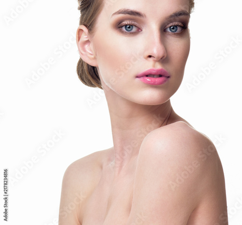 Beautiful Young Woman with Clean Fresh Skin. Close up Portrait.  Fashion Model Girl Face. Perfect Skin. Professional Makeup, gloss lips.
