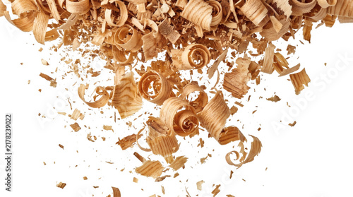 Natural pine wood shavings and sawdust falling downwards top border frame overlay isolated on transparent background.