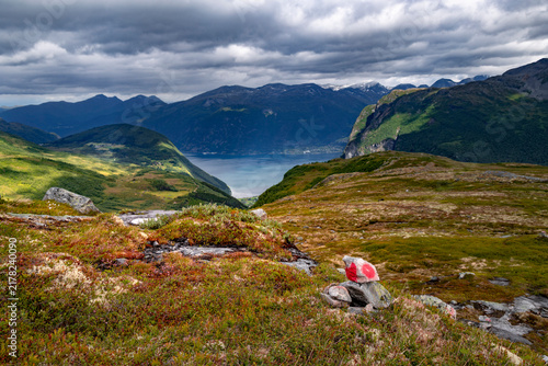 Photography A beatiful landscape with a marked hiking trail leading up the mountain