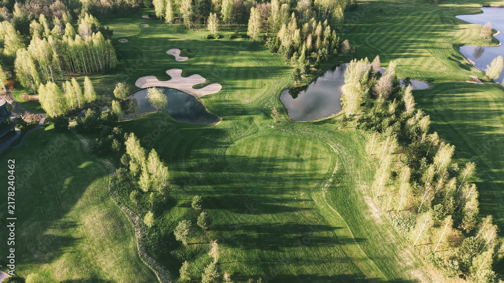 Fototapeta premium Exclusive golf resort landscape in warm evening sunlight