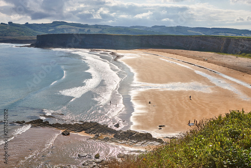 Sand beach in Cantabria at sunset. Atlantic ocean. Langre, Spain