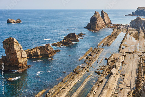 Solitary rocky beach of Arnia. Urros formation. Cantabria coastline. Spain