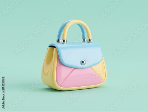 Small fashionable handbag with pastel colors isolated on a light green background for a spring fashion concept