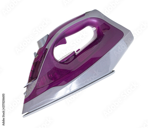 фотографія Purple steam iron for household laundry and clothing care