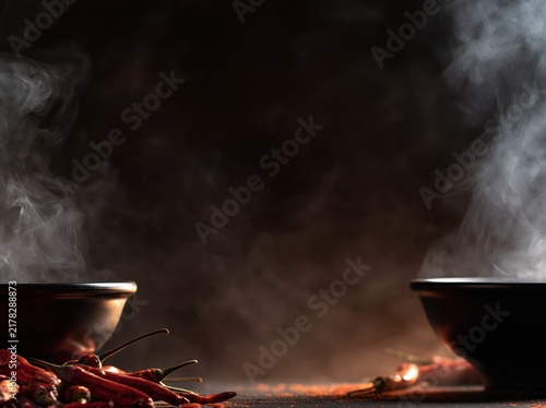 Steaming Cooking Pots with Red Chili Peppers