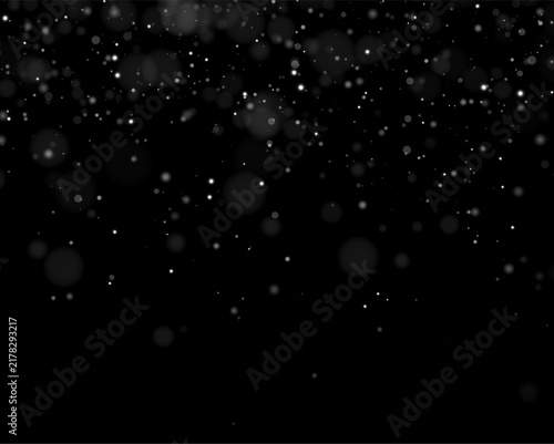 Obraz na płótnie Soft white bokeh lights scatter chaotically on a deep black background
