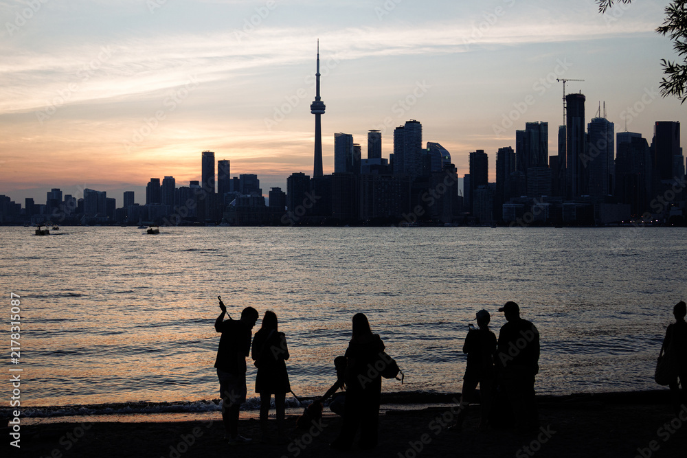 Fototapeta premium Toronto skyline with CN Tower and waterfront on Lake Ontario at sunset, Ontario, Canada. g.