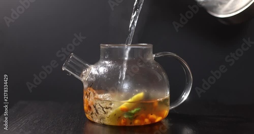 aromatic sea buckthorn vitamin tea on a dark background
