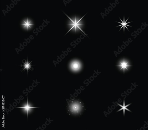 White light effect design set. Isolated on a black background. EPS vector sun flash with spotlight rays; sparkling lights set. 