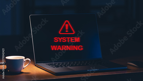 Office Laptop Displays System Warning and Cybersecurity Security Alerts, Malware Infection, Ransomware Risk, Hacking Threat, and Data Breach. Computer System Compromise Warning and Cybersecurity