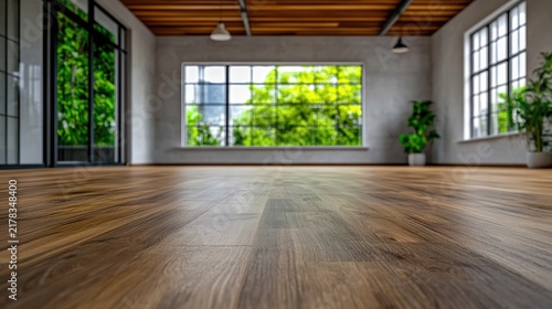 Serene interior with wooden floor and verdant view creating a natural tranquility