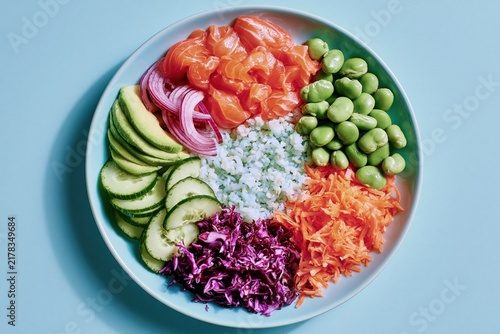 Bright colors and fresh ingredients create a perfect salmon poke bowl display