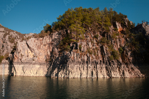 Scenic mountain lake at Green Canyon, Turkey, under a clear blue summer sky