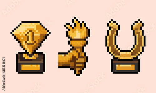 pixel art of gold trophy awards set including golden diamond number one, holding torch hand, and horseshoe prize, perfect for RPG game UI