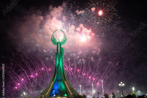 Spectacular colorful fireworks illuminating the Humo Bird Stella in Yangi Uzbekistan, Tashkent, Uzbekistan, at night. Dramatic festive scene featuring the iconic national symbol against a vibrant illu