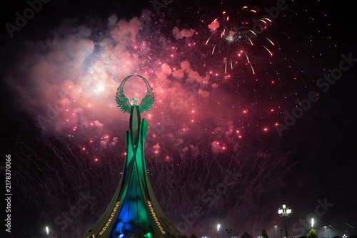 Spectacular colorful fireworks illuminating the Humo Bird Stella in Yangi Uzbekistan, Tashkent, Uzbekistan, at night. Dramatic festive scene featuring the iconic national symbol against a vibrant illu
