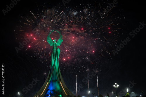 Spectacular colorful fireworks illuminating the Humo Bird Stella in Yangi Uzbekistan, Tashkent, Uzbekistan, at night. Dramatic festive scene featuring the iconic national symbol against a vibrant illu