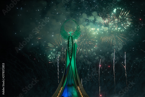 Spectacular colorful fireworks illuminating the Humo Bird Stella in Yangi Uzbekistan, Tashkent, Uzbekistan, at night. Dramatic festive scene featuring the iconic national symbol against a vibrant illu