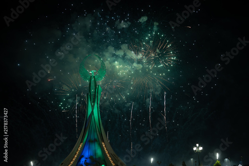 Spectacular colorful fireworks illuminating the Humo Bird Stella in Yangi Uzbekistan, Tashkent, Uzbekistan, at night. Dramatic festive scene featuring the iconic national symbol against a vibrant illu