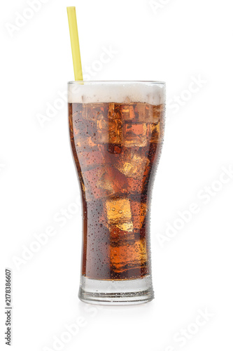 Tall glass of iced cola with foam and a yellow straw on a white background