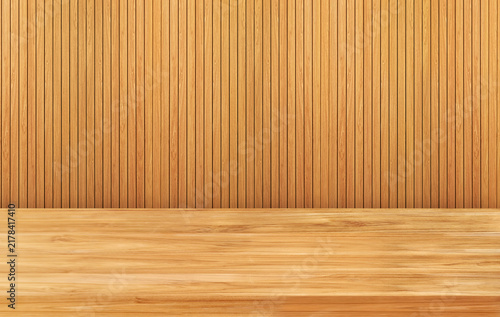 Empty wooden table top with vertical wood lath wall background.