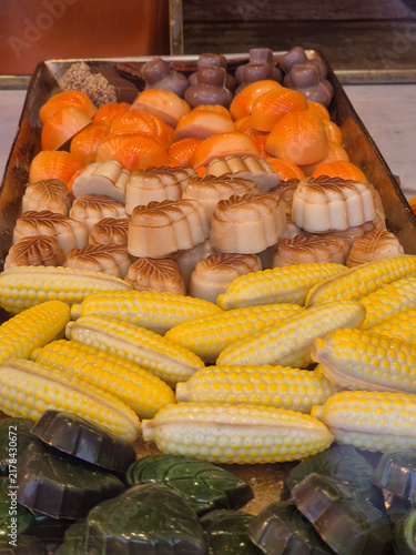 Molded chocolate candies shaped like corn cobs leaves and pumpkins