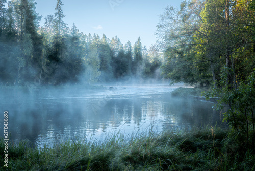 Autumn river in a foggy morning. Farnebofjarden national park in north of Sweden