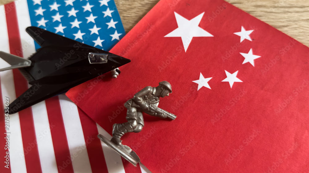 Obraz premium Toy plane with USA and china flag 