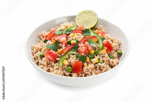 Bowl of fresh ground chicken with colorful vegetables