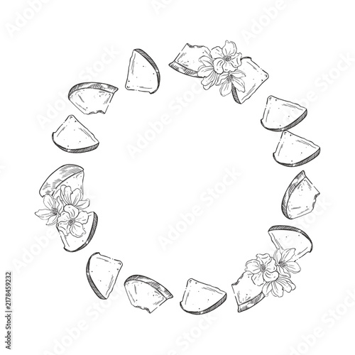 A wreath of pear pieces and blossoming fruit tree flowers. All objects are hand-drawn in ink. Round frame for greeting card design, menu, packaging and harvest concept. Vector illustration