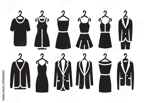 Collection of formal dresses and suits on hangers for luxury boutique fashion retail and clothing store.