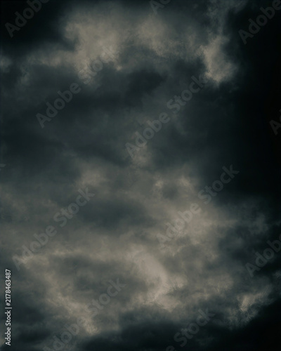 Dark storm clouds gather across a moody sky, creating a powerful atmospheric background ideal for weather, climate, cinematic concepts and dramatic environmental designs.