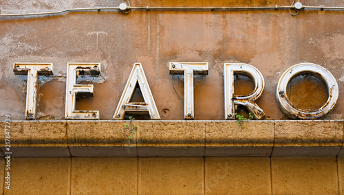 Weathered vintage Teatro sign on old building facade in Verona, Italy