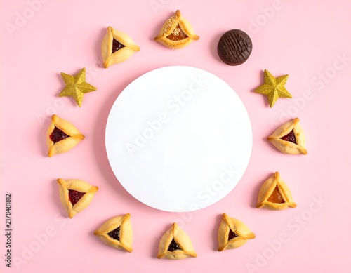 Holiday food arranged in a circle around a white disc on a pink background