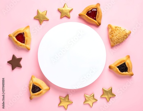 Pink background with triangular pastries, golden stars, and a central white circle