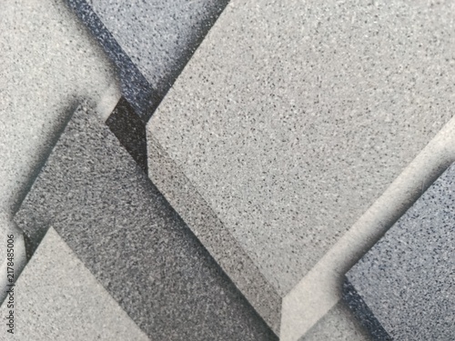 Fotografía cAn abstract 3D geometric pattern featuring textured blocks in varying shades of