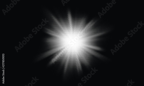Bright glowing white starburst light effect with radial rays shining on a dark black background for graphic design