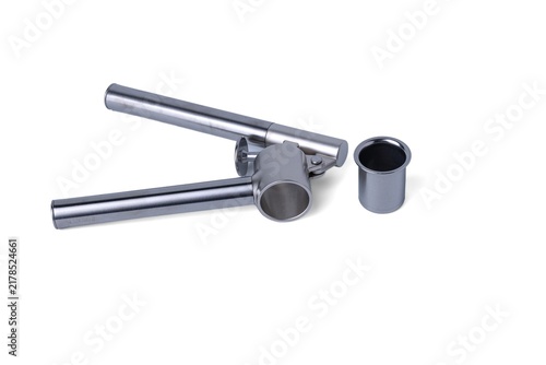 Cuadro en lienzo Metal garlic press crusher tool isolated on a pure white background