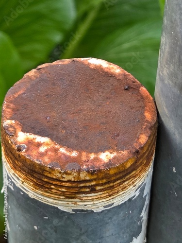 Obraz na plátně Close up top view of a rusty iron pipe with threaded end and corrosion texture,