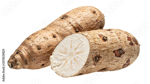 Two raw cassava roots, one whole and one sliced showing white starchy interior texture and rough brown skin isolated on a transparent background