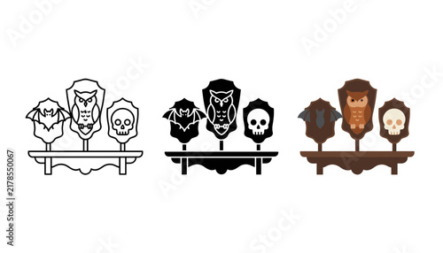 Set of three wall plaques with a bat, an owl, and a skull