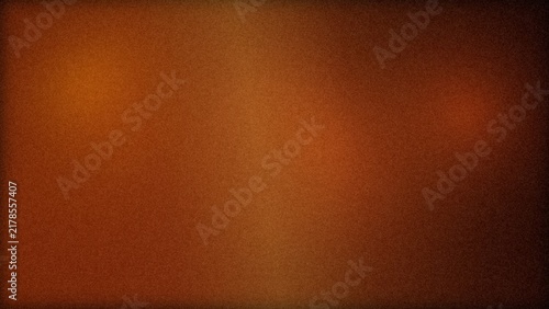 Abstract dark brown and orange gradient background with a soft textured surface and a subtle vignette lighting effect